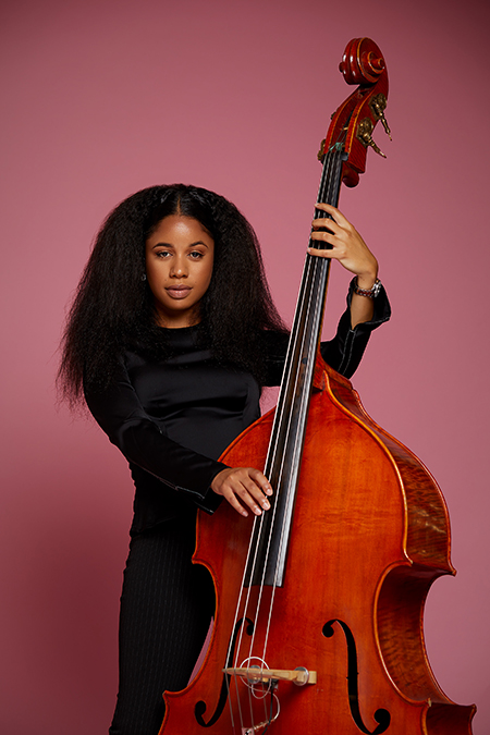 Aneesa Strings poses with her upright bass.